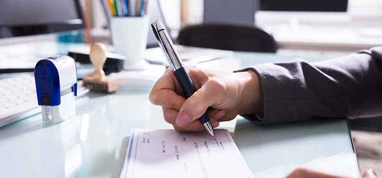 Man signing a check